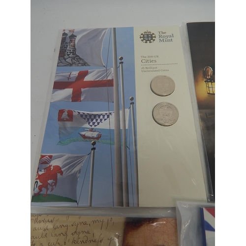 216 - Brilliant Uncirculated £1 and £2 coins in folders face value £15