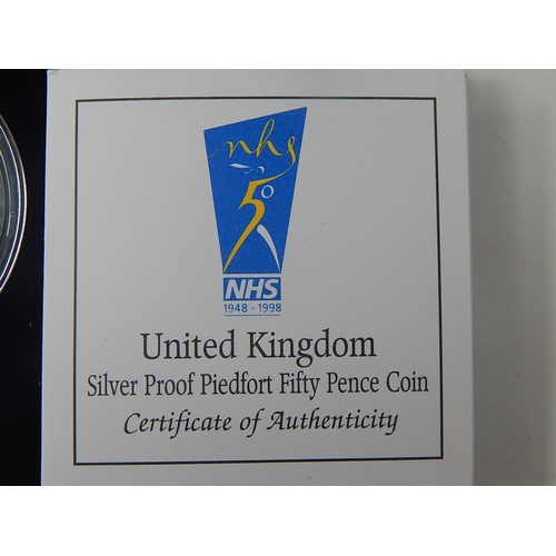 282 - Large Bronze Medallion Hillsborough Memorial 1989 cased; 1998 Silver Proof 50p NHS and another in Pi... 