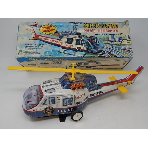 528 - 1960's Tin Plate Super Flying police Helicopter from the TV series Highway Patrol (boxed)