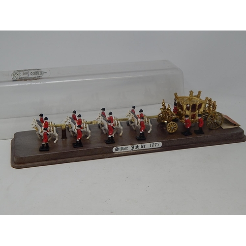 535 - Queen Elizabeth II Silver Jubilee State Coach & Horses together with footmen: Measures 36cm long wit... 