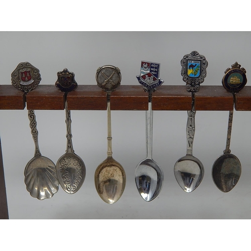 564 - Collection of Silver Plated & White Metal Souvenir Spoons with Wooden Rack.