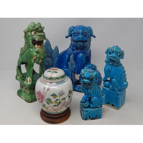 583 - Four Oriental Tomb Dogs together with a Chinese Ginger Jar on Wooden Stand. The Tallest 26cm