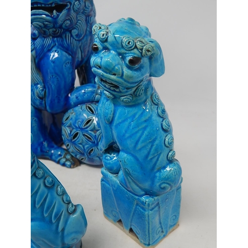 583 - Four Oriental Tomb Dogs together with a Chinese Ginger Jar on Wooden Stand. The Tallest 26cm