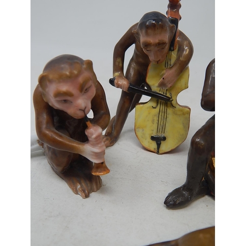 584 - Monkey Band: Comprising Monkeys Playing Instruments & a Further Monkey with His Hands Over His Ears.