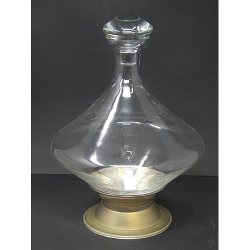 587 - BODA: Shaped Clear Glass Decanter & Stopper on White Metal Stand. Height 26.5cm