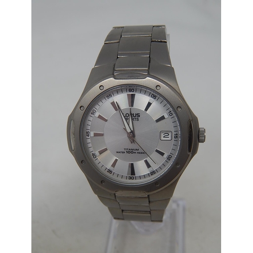 24 - Lorus: Gentleman's Sports Titanium 100m Water resistant Date Wristwatch. Working Well Presently.