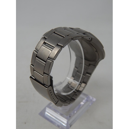 33 - Lorus: Gentleman's Sports Titanium 100m Water resistant Date Wristwatch. Working Well Presently.