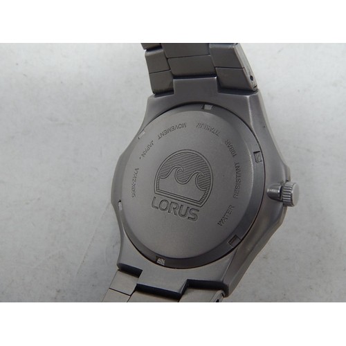33 - Lorus: Gentleman's Sports Titanium 100m Water resistant Date Wristwatch. Working Well Presently.