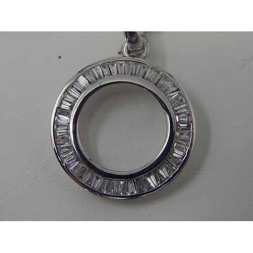 36 - 18ct White Gold Pendant set with tapering baguette cut diamonds, channel set totalling 1.0ct on an 1... 