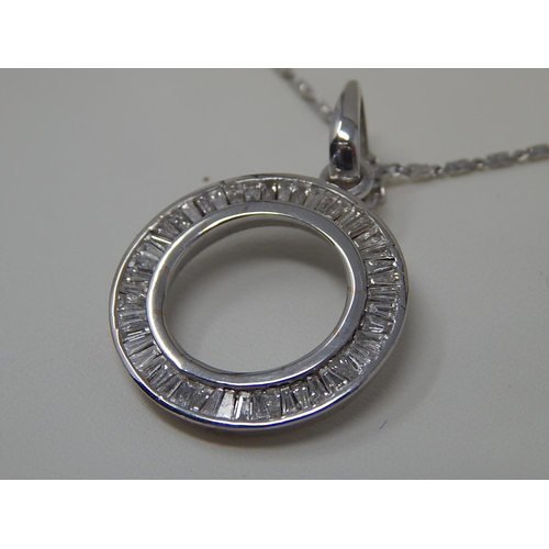36 - 18ct White Gold Pendant set with tapering baguette cut diamonds, channel set totalling 1.0ct on an 1... 