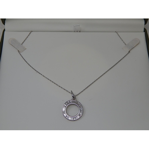 36 - 18ct White Gold Pendant set with tapering baguette cut diamonds, channel set totalling 1.0ct on an 1... 