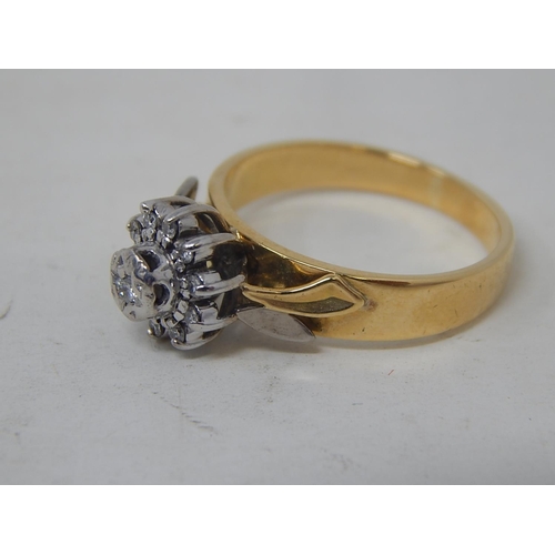 38 - 18ct Yellow & White gold diamond ring with 11 round cut brilliant cut diamonds claw set in cluster
