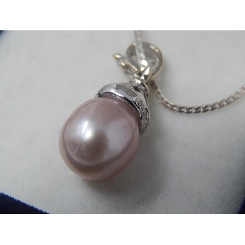 41 - South Sea Pearl with 8 round brilliant cut Diamonds, Micro claw set, pendant is on sterling silver c... 