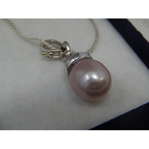41 - South Sea Pearl with 8 round brilliant cut Diamonds, Micro claw set, pendant is on sterling silver c... 