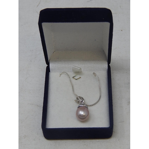 41 - South Sea Pearl with 8 round brilliant cut Diamonds, Micro claw set, pendant is on sterling silver c... 