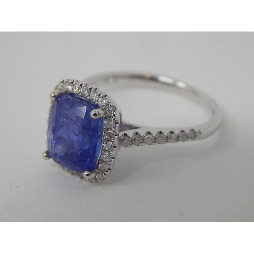 52 - 18ct White Gold Tanzanite & Diamond ring featuring centre cushion cut dark violet blue Tanzanite (4.... 