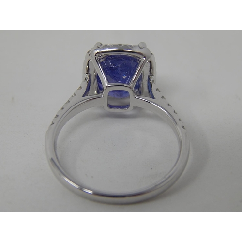 52 - 18ct White Gold Tanzanite & Diamond ring featuring centre cushion cut dark violet blue Tanzanite (4.... 