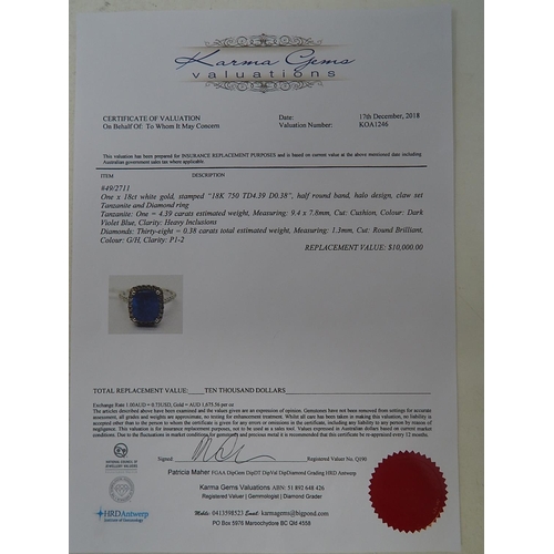 52 - 18ct White Gold Tanzanite & Diamond ring featuring centre cushion cut dark violet blue Tanzanite (4.... 