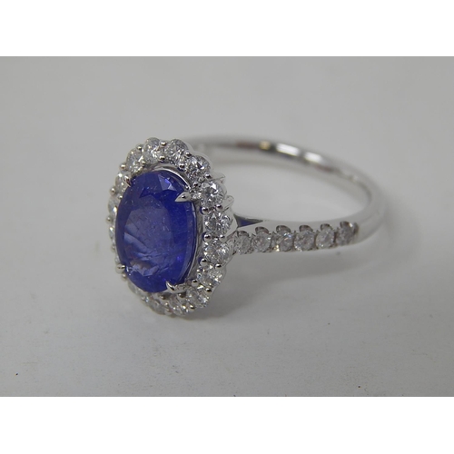 53 - 18ct White Gold tanzanite & diamond ring with centre oval cut pupleish blue Tanzanite (2.56ct)claw s... 