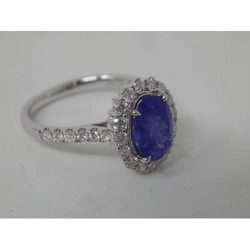 53 - 18ct White Gold tanzanite & diamond ring with centre oval cut pupleish blue Tanzanite (2.56ct)claw s... 