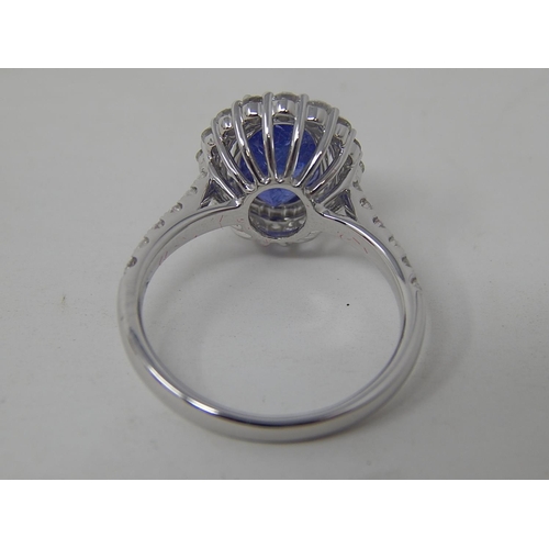 53 - 18ct White Gold tanzanite & diamond ring with centre oval cut pupleish blue Tanzanite (2.56ct)claw s... 