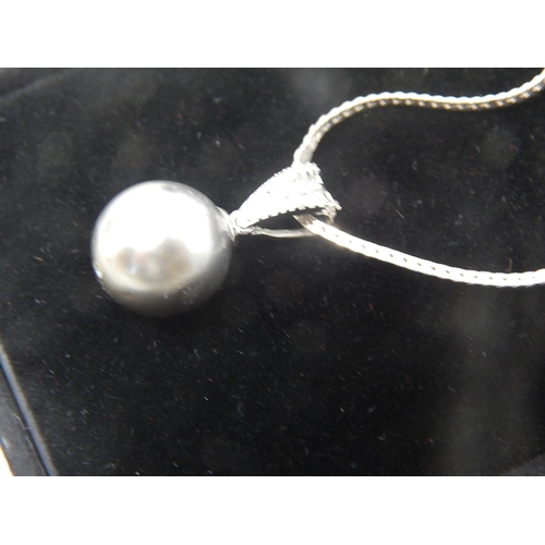 55 - Vintage White Gold Pearl & Diamond pendant featuring light silver black Tahitian Pearl, with 10 roun... 