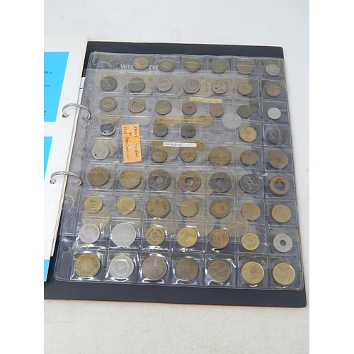 70 - Album containing large collection of coins and tokens