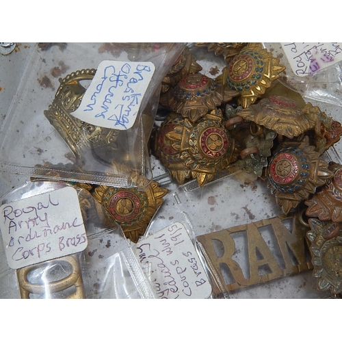 100 - Tin box of military cap badges