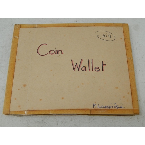 109 - Vintage coin wallet containing 12 x early Jettons