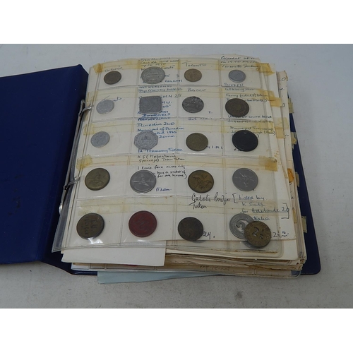 134 - Vintage coin album containing a substantial collection of World coins and tokens