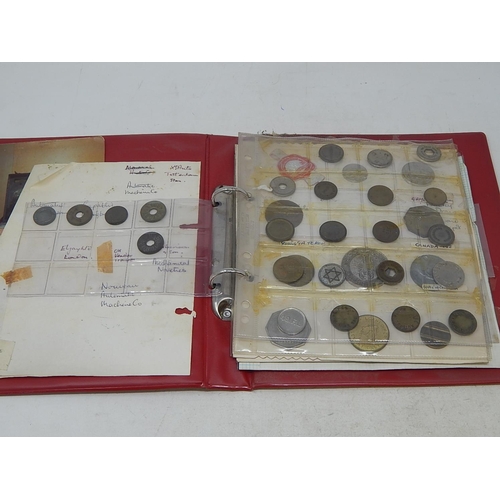 154 - Red vintage coin album containing a collection of tokens, etc