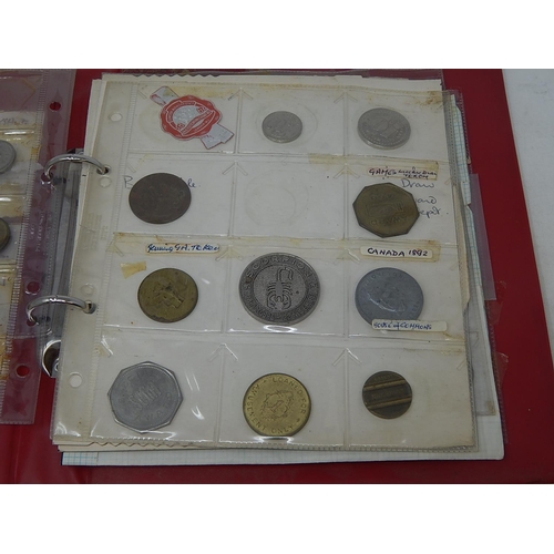 154 - Red vintage coin album containing a collection of tokens, etc