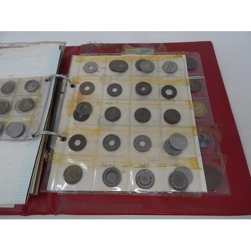 154 - Red vintage coin album containing a collection of tokens, etc