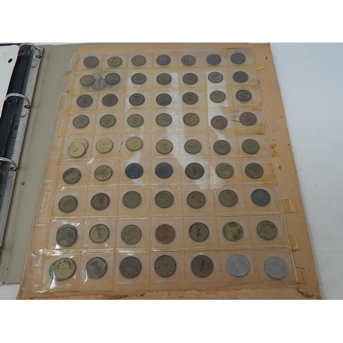 155 - A very substantial collection collection of tokens, jettons, etc housed in album