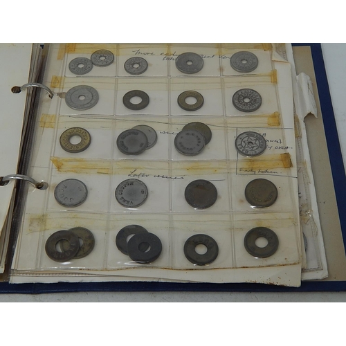 168 - Very substantial collection of USA amusement machine tokens housed in vintage album