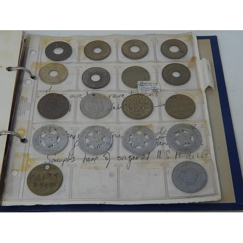 168 - Very substantial collection of USA amusement machine tokens housed in vintage album