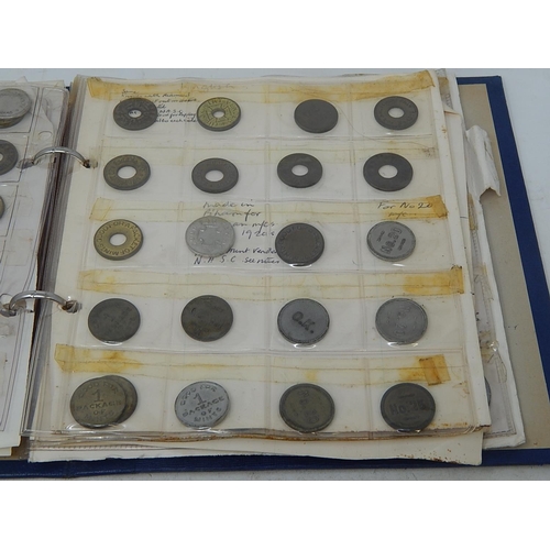 168 - Very substantial collection of USA amusement machine tokens housed in vintage album