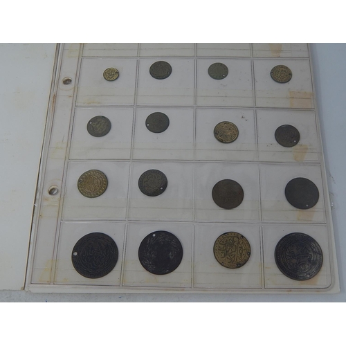 176 - Good selection of vintage tokens on 6 album pages, many identified