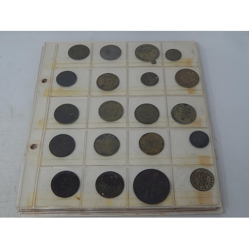 176 - Good selection of vintage tokens on 6 album pages, many identified