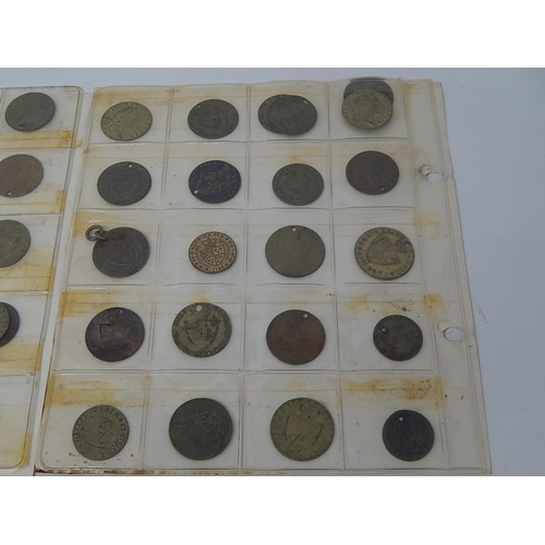 195 - Large collection of George III Guinea, Half Guinea Brass Tokens on 3 album pages