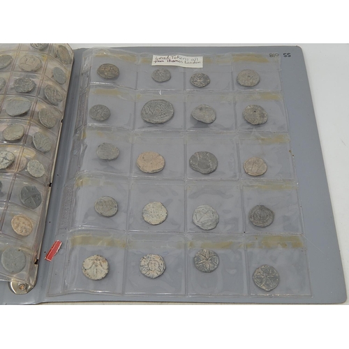 222 - An album with a large collection of leaden tokens, some found in the Thames, with a large quantity o... 