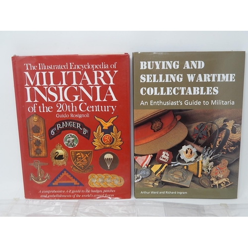 403 - Military cap badges, etc and a collectors book