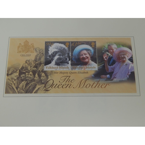 266 - The Queen Mother 1900-2002 de-luxe stamp and colour illustrated cover collection housed in black alb... 