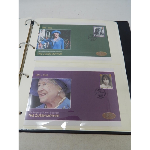 266 - The Queen Mother 1900-2002 de-luxe stamp and colour illustrated cover collection housed in black alb... 