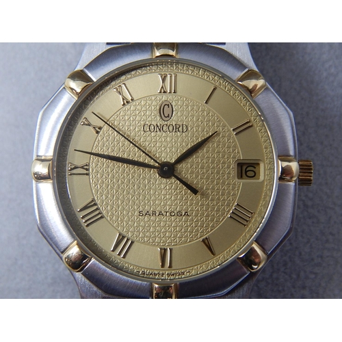 76 - Gentleman's CONCORD SARATOGA 18ct Gold & Stainless Steel Wristwatch with Date Aperture. The Watch is... 