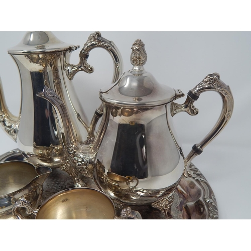 138 - Silver Plated Wares: Four Piece Tea & Coffee Set on Circular Silver Plated Tray Measuring 38.5cm dia... 