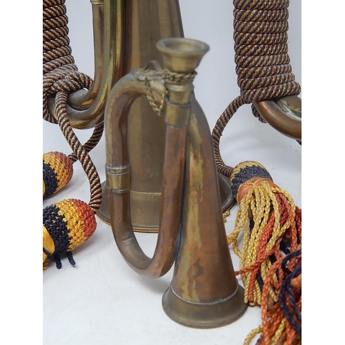 54 - Military: Pair of Brass & Copper Regimental Bugles together with a similar small bugle.