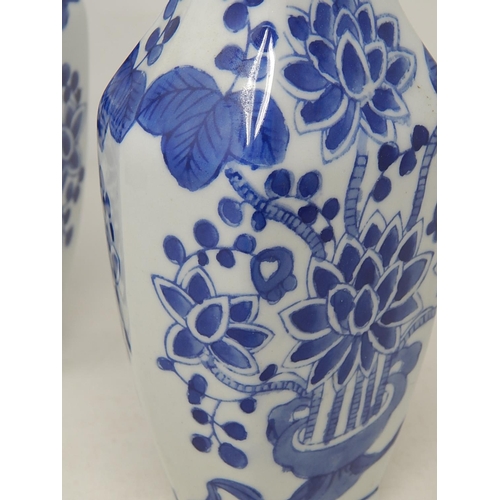 98 - Pair of Chinese Blue & White Vases: Marks to bases: Height 23cm.