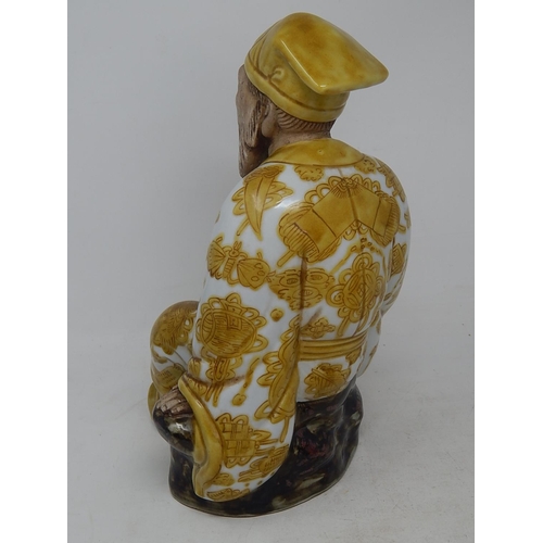 124 - Large Japanese Yellow Glazed Figure with Matt Features: Impressed Seal Mark to Base: Measures 27cm h... 