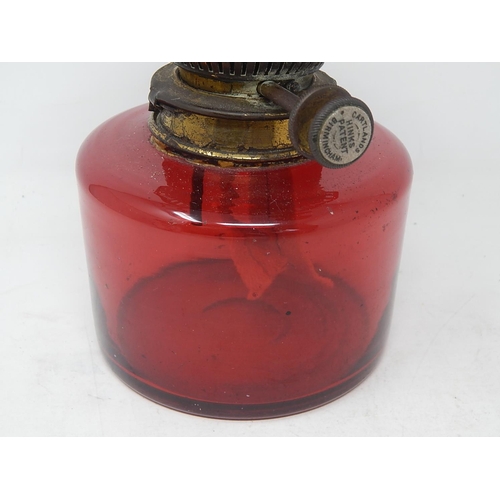 132 - Victorian Cranberry Glass Oil Lamp with HINKS Burner & Glass Funnel. Measures 42cm high